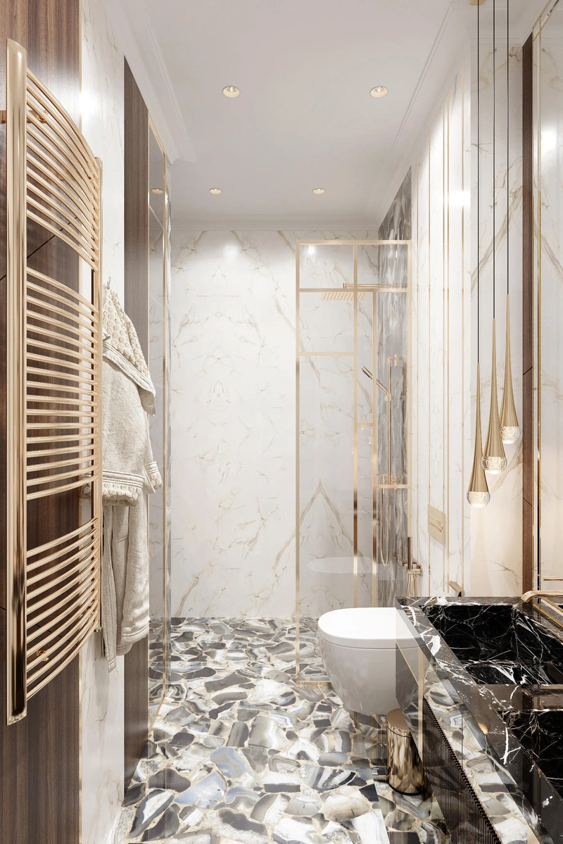 Полотенцесушитель золотого цвета в интерьере ванной