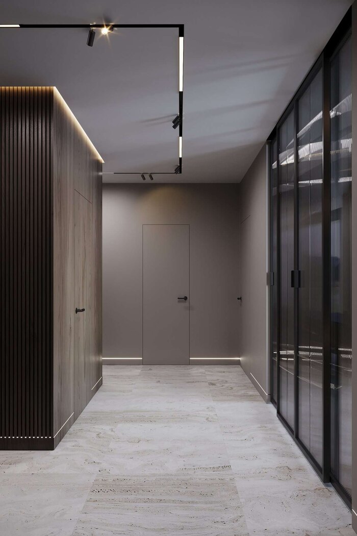 Раздвижные двери со стеклянными вставками и подсветка подчёркивает архитектурные линии интерьера