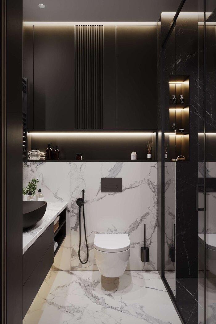 Контрастное оформление инсталляции туалета, сочетание белого мрамора и темного дерева